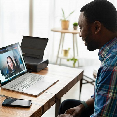 A man going through a call with an online support for addiction.