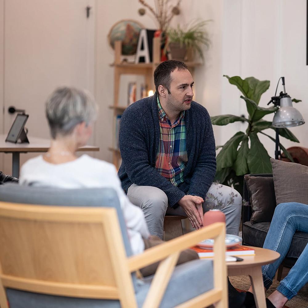 Clinical Advisor Dr. Michael Berry, R. Psych speaks to a group during an invitational drug and alcohol intervention in Canada