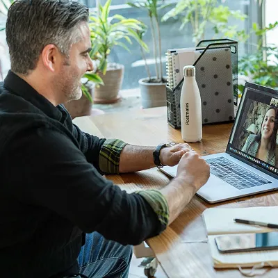 An addiction coach doing an online session with a client.