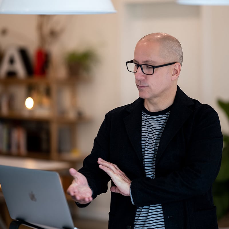 Certified Canadian Recovery Coach Michael Walsh conducts an online mentoring session with an aspiring coach using secure video chat